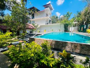 a swimming pool in the garden of a villa at Victory Villa Sigiriya in Sigiriya