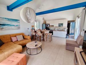 a living room with a couch and a table at Villa Alba in Vodnjan