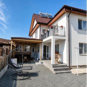 a house with a playground in front of it at Casa samo in Vama Veche