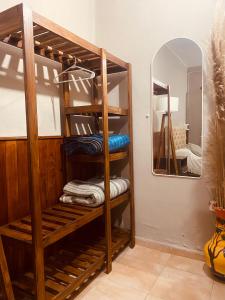 a room with a bunk bed with a mirror at La moora in Alta Gracia