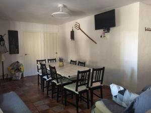 a dining room with a table and chairs at Casa Rural Prado Alto,Foz Calanda in Foz-Calanda