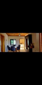 a living room with a dining room table and chairs at Casa in Durrës