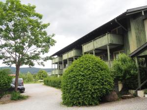 a building with a car parked in front of it at Apartment 35, 36 Christopherhof Grafenwiesen in Grafenwiesen