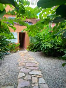 a stone walkway in front of a building at Belém Forest Inn in Belém