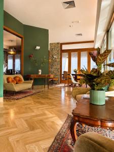 a living room with a couch and a table at Hotel Columbia Frontemare in Rimini
