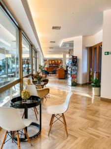 a lobby of a store with chairs and tables at Hotel Columbia Frontemare in Rimini