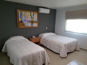 Postel nebo postele na pokoji v ubytování Casa RyS Hotel