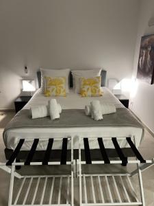 a large bed in a room with two pillows at New Large Studio - Monaco Border - Sea View - Lift - Parking included in Beausoleil