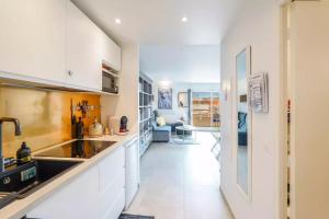 a kitchen with a sink and a counter top at New Large Studio - Monaco Border - Sea View - Lift - Parking included in Beausoleil