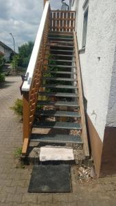 a set of stairs leading up to a building at Bauernwohnung in Waldmünchen +6 photos