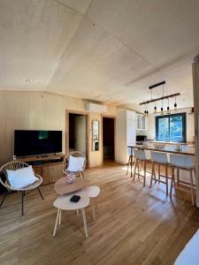 a large living room with a table and chairs at N&L Signature - Ô Lodge in Mornas