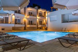 a swimming pool in front of a building at Porto Dionysos in Ofrínion +42 photos