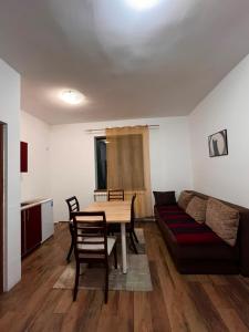a living room with a table and a couch at Musical Pansion Radgost, Rtanj in Rtanj +42 photos