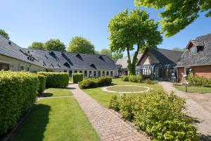 a courtyard of a house with a walkway at Hovborg Kro in Hovborg