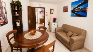 a living room with a table and a couch at Villa Olimpo B&B in Fasano