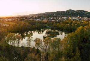 an aerial view of a lake in a city at M&L Hartberg in Hartberg