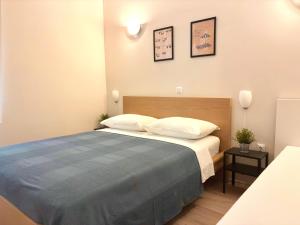 a bedroom with a large bed with two pillows at Lenka Apartments I in Novalja +60 photos