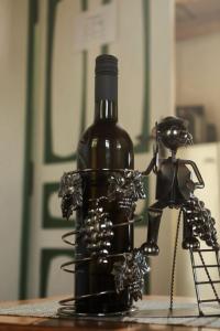 a bottle of wine sitting on top of a table at Jurina Hiža in Beletinec +22 photos