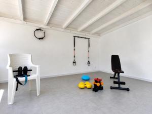 a room with a room with two chairs and a table at Reale Home in Casa Tonietti