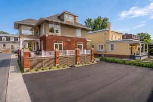 a house with a large deck on a driveway at Les Suites Du Vieux-Lévis - With AC and Parking in Lévis