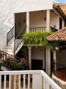 a house with stairs and plants on it at Hotel Aguablanca in La Mesa