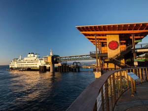 a cruise ship docked at a dock with a cruise ship at Soundview Ferry Cottage in Mukilteo +10 photos