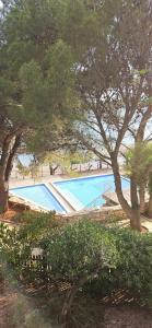 an overhead view of a swimming pool with trees at Villa Renata in Pirovac