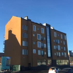 a building with a shadow on the side of it at Sunshine Apartment in Turku