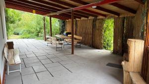 a patio with a table and benches on it at Dobó Tanya in Röszke +74 photos