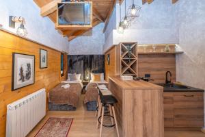 a bedroom with a bed and a sink in a room at Rooms and apartmants Mirovic in Kolašin