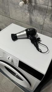 a hair dryer is sitting on top of a appliance at Квартира в центре города in Komrat