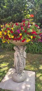 a statue of a person holding a pot of flowers at Victorian Renovation Room 5 in Liverpool