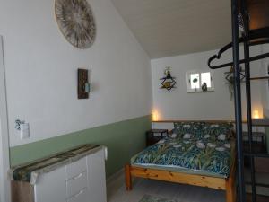 a bedroom with a bed and a ladder at Carma de Madeira Lodge in Penela