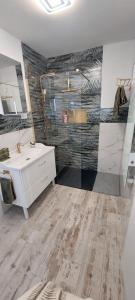 a bathroom with a white sink and a mirror at Carma de Madeira Lodge in Penela +17 photos