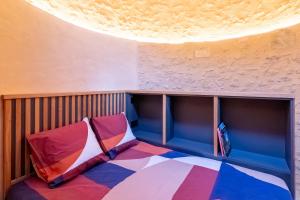 a room with a colorful floor and a ceiling at Moulin insolite - Rooftop - Proche St-Emilion in Saint-Vincent-de-Pertignas