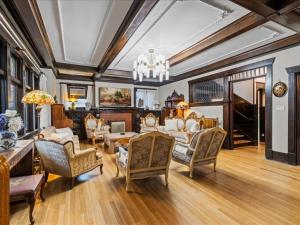 a living room filled with furniture and a chandelier at Stonehurst Estate Sleep 16 in Chilliwack
