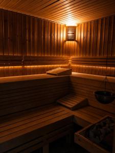 a sauna with a light on the inside of it at Hotel Paradise in Ognyanovo +50 photos
