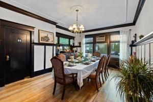 a dining room with a table and chairs at Stonehurst Estate Sleep 16 in Chilliwack