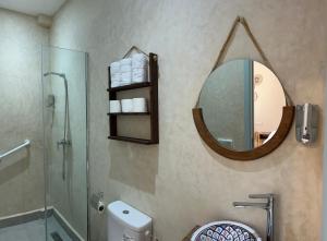 a bathroom with a shower and a mirror on the wall at Imsouane Harmony in Imsouane +49 photos