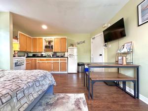 a kitchen with a bed and a desk in a room at Summer Sale 1BR Big Kitchen by River and Trails in Bridgewater