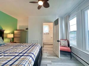 a bedroom with a bed and a ceiling fan at Summer Sale 1BR Big Kitchen by River and Trails in Bridgewater +18 photos