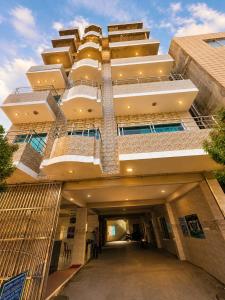 a large building with a hallway in front of it at Hotel Nice Look Kuakata in Kuākāta