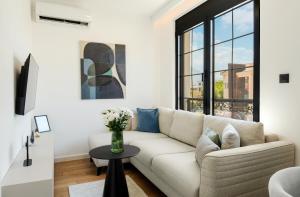 a living room with a couch and a table at One bedroom Belane Rezident in Tivat