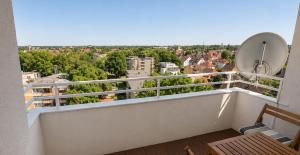 a balcony with a view of a city at Apartment Hannover - Langenhagen center in Hannover
