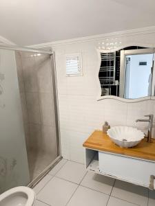 a bathroom with a sink and a shower at Air Otel in Trabzon +12 photos