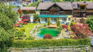 an aerial view of a house with a swimming pool at Haus Katharina in Bad Hofgastein