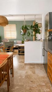 a kitchen and living room with a white counter top at Blossom Apartment Kos in Ampavris