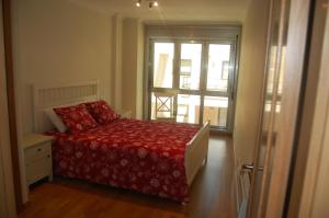 Posteľ alebo postele v izbe v ubytovaní Apartamentos Cedeira