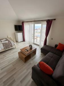 a living room with a couch and a coffee table at Air Otel in Trabzon