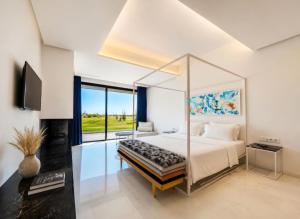 a bedroom with a large bed and a large window at Luxury Premium Villa Golf Resort Private Pool in Marrakesh +25 photos